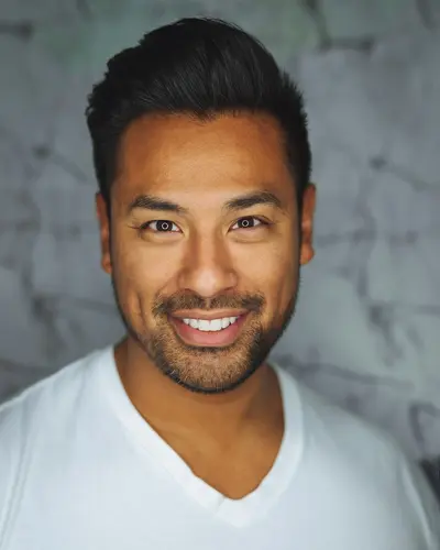Original photo: a man in a white t-shirt against a gray wall