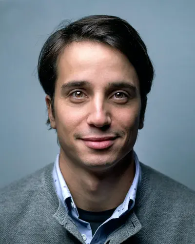 Original photo: a man in a gray sweater on a blue background