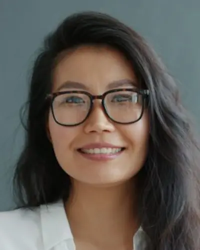 Original photo: a woman with glasses in a white blouse