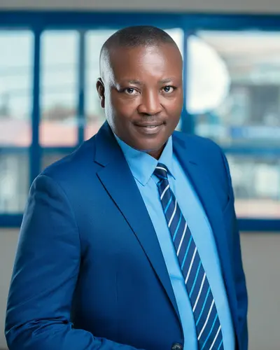 Original photo: a man in a blue suit and striped tie