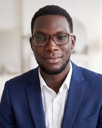AI example made from that photo: the same man in a navy blazer in a bright home