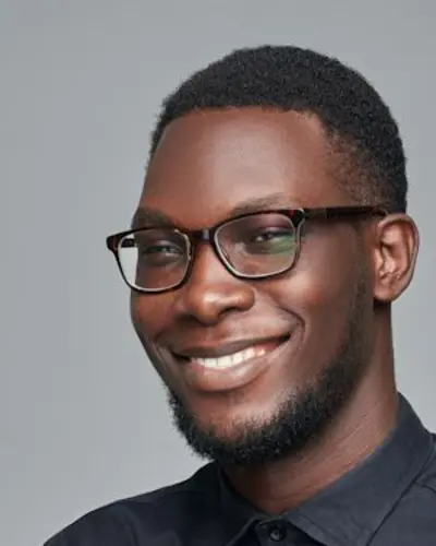 Original photo: a man with glasses in a black shirt