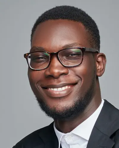 Original photo: a man with glasses in a black suit